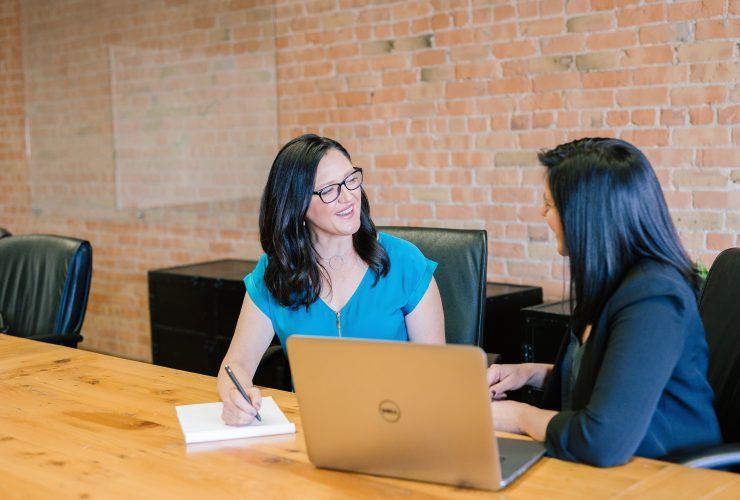 A woman interviewing a job candidate.